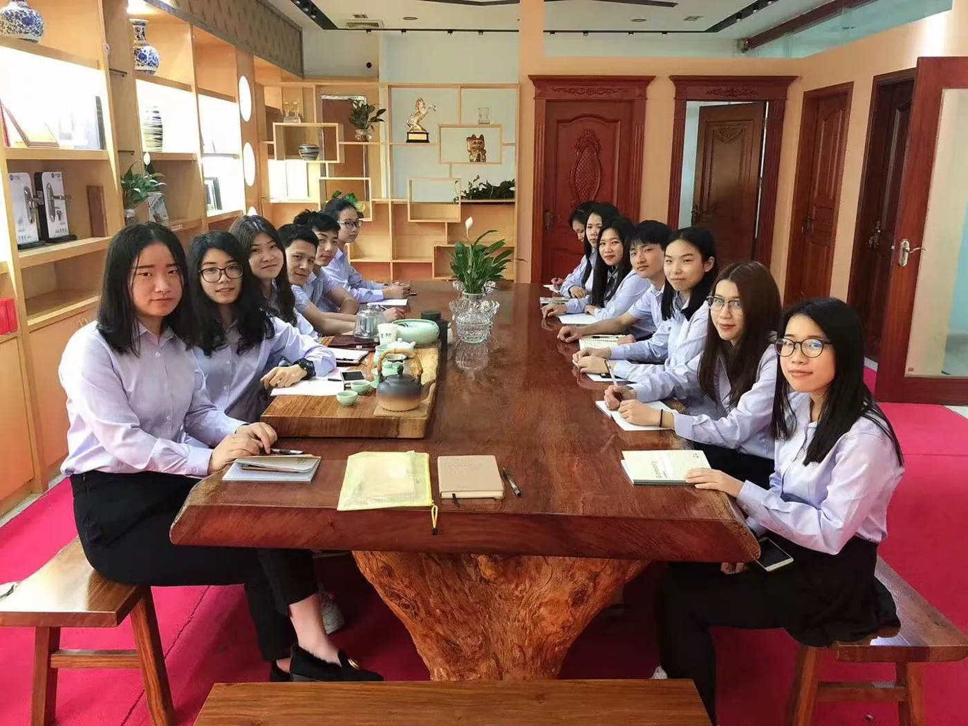 Historical trade team seated in a showroom